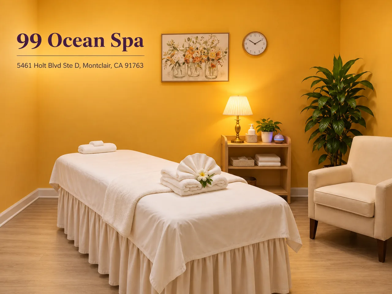 Clean massage room with fresh towels and warm lighting at 99 Ocean Spa in Montclair, CA